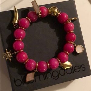 Pink bracelet with charms from Bloomingdales.